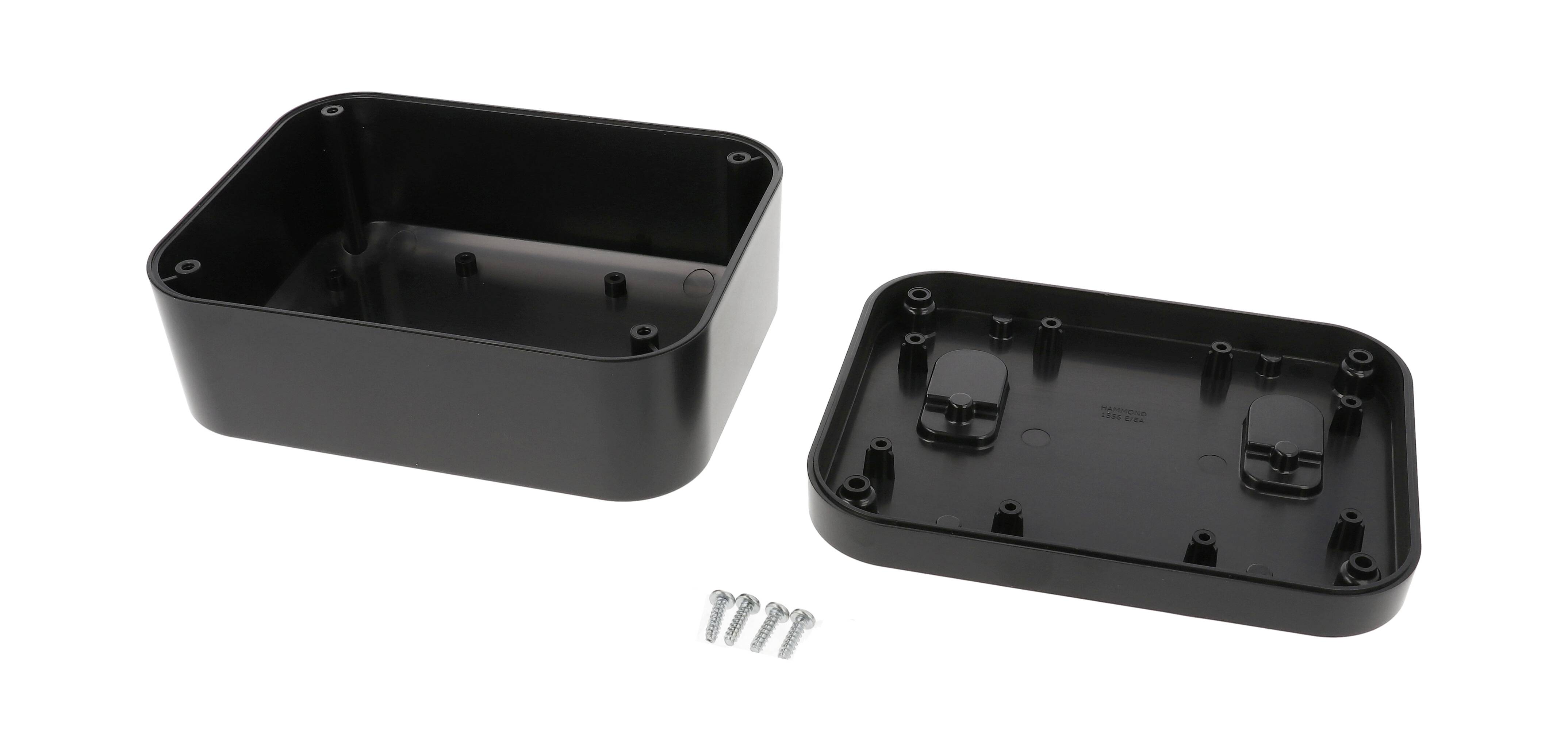 Black, rectangular plastic casing, opened into two parts, with four metal screws in front.