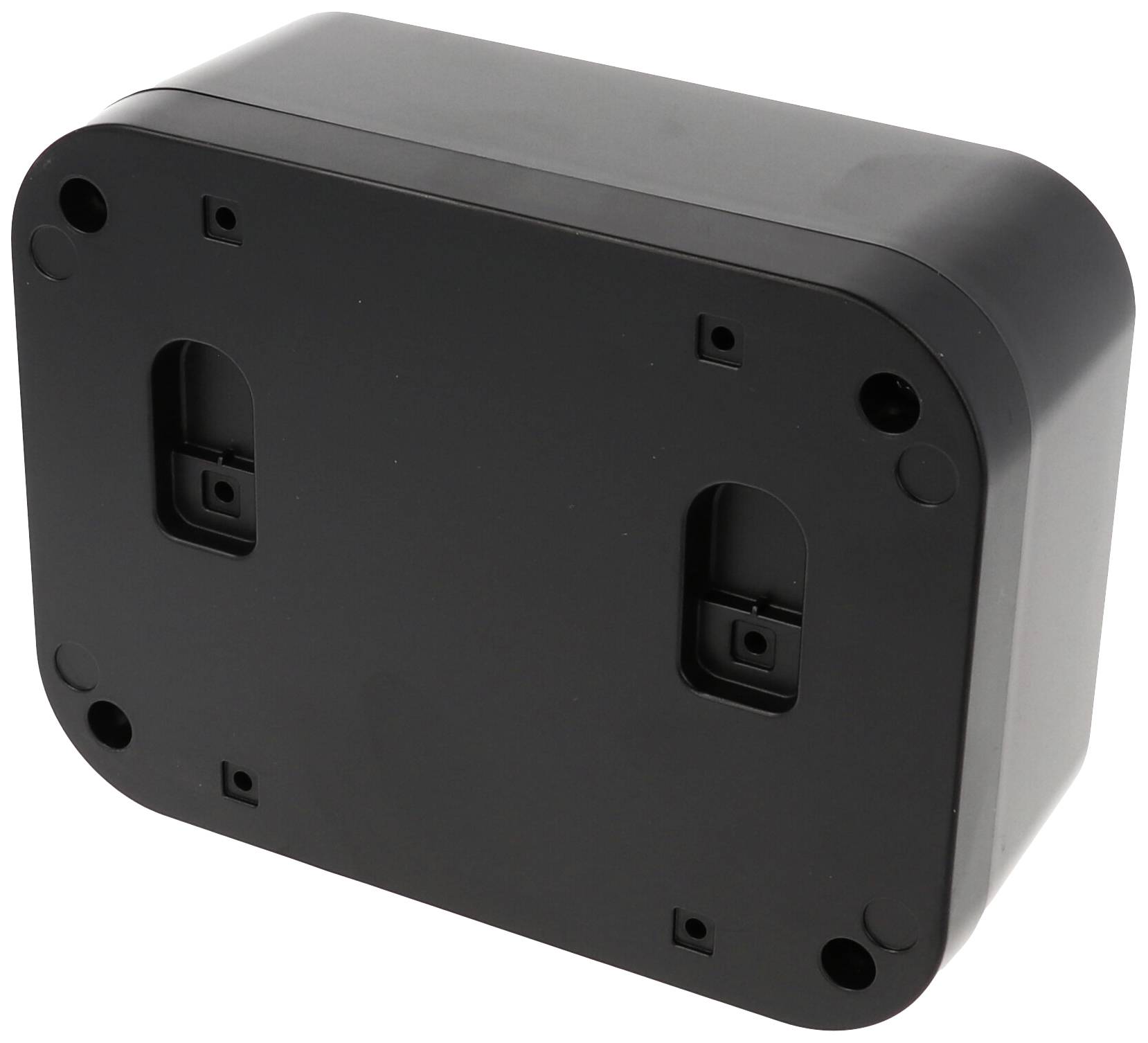 Black rectangular plastic casing with rounded corners, showing the underside with four screw holes for mounting.