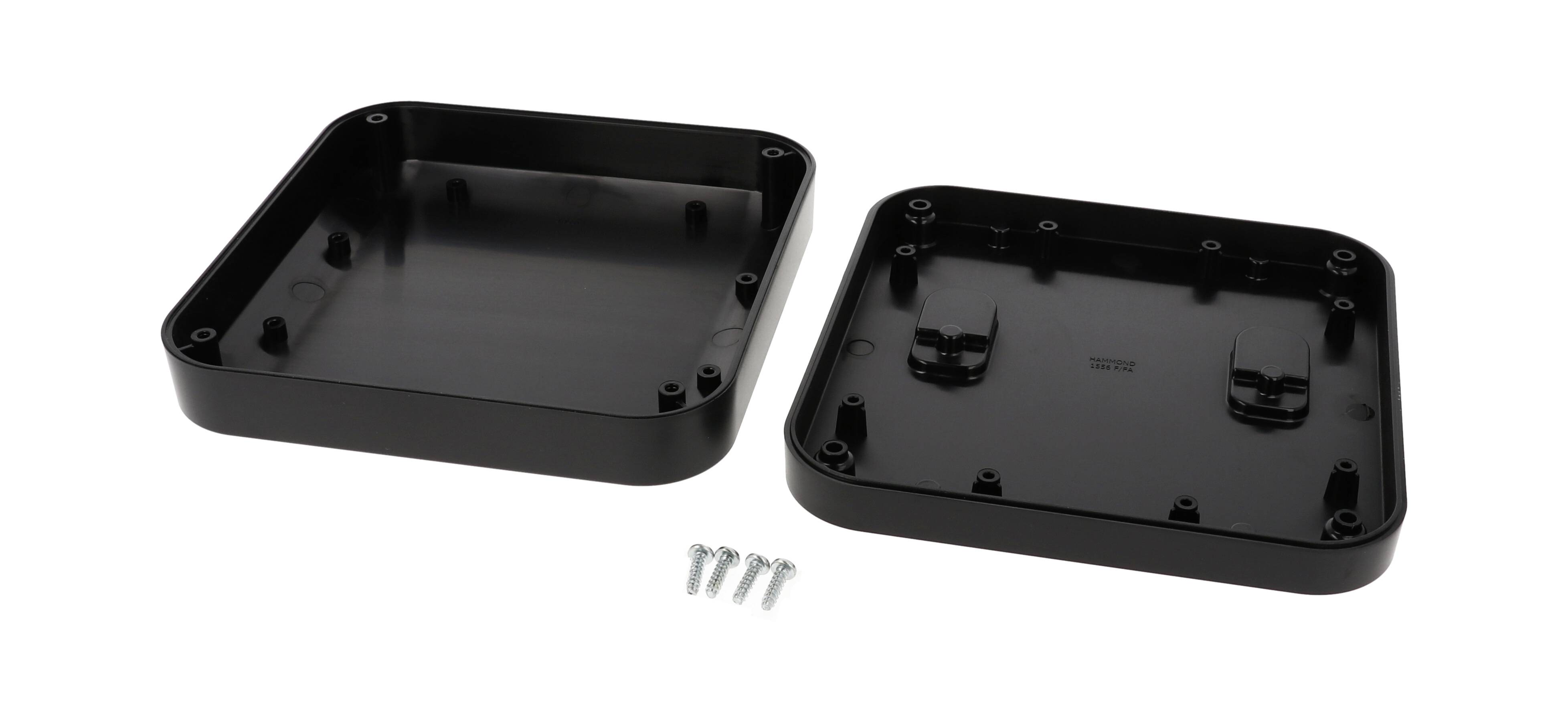 Black, square casing made of two parts with six silver screws on a white background, open for assembly.