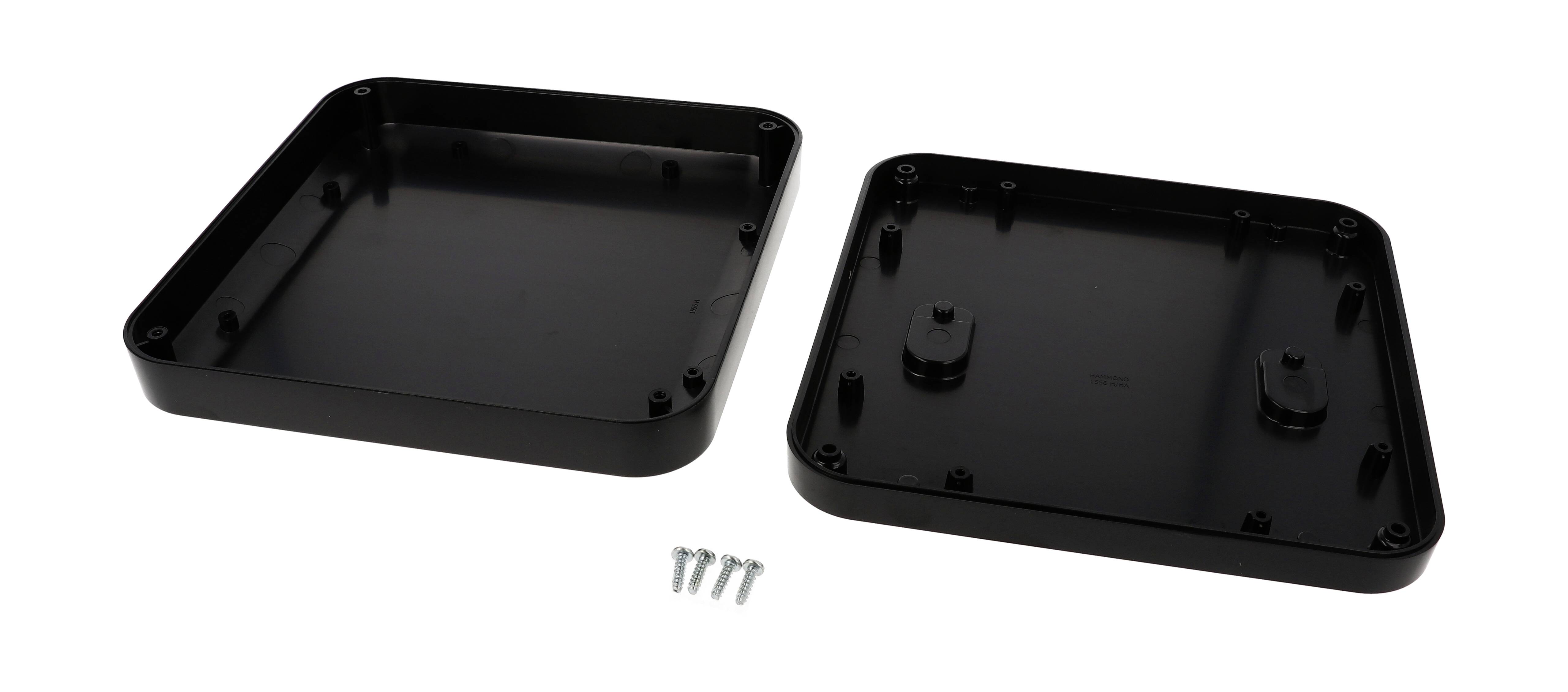 Two black plastic housing components and four silver screws.