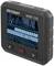 A black device serving as a testing tool displays an image of electrical wiring and devices on its screen.