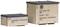 Two wooden crates with labels: 'Krasnodar', 'USSR'. Smaller one on the left, larger one on the right. Transport crates possibly from East Germany.