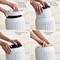'Step-by-step pictorial guide to changing a filter in an air purifier in four steps: 1. Remove lid, 2. Take out old filter, 3. Insert new filter, 4. Close lid.'