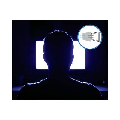 A person sits in front of a bright screen in a dark room. Beside them is a symbol indicating air flow or ventilation.