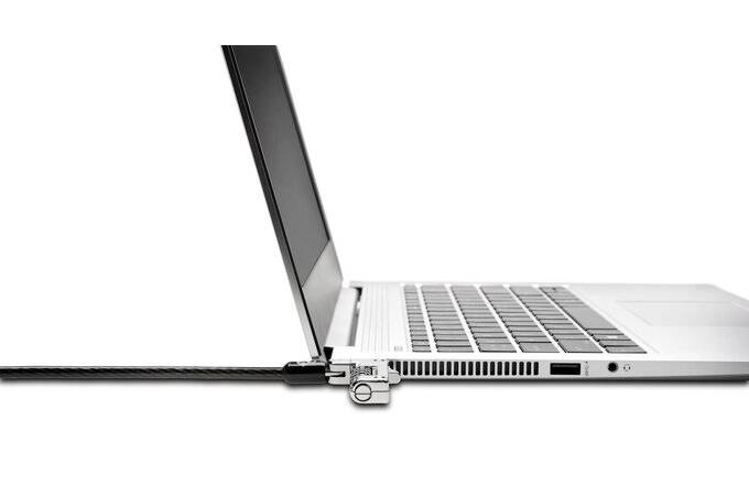 A laptop is secured with a security lock. The cable is plugged into the lock and prevents theft or unauthorised access.