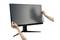 A person is applying an anti-glare protective film to a large computer monitor; the film reduces glare and reflections.