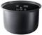 A black rice cooker pot with markings for raw and cooked volume ranging from 1.5 to 3 litres. The maximum is also marked.
