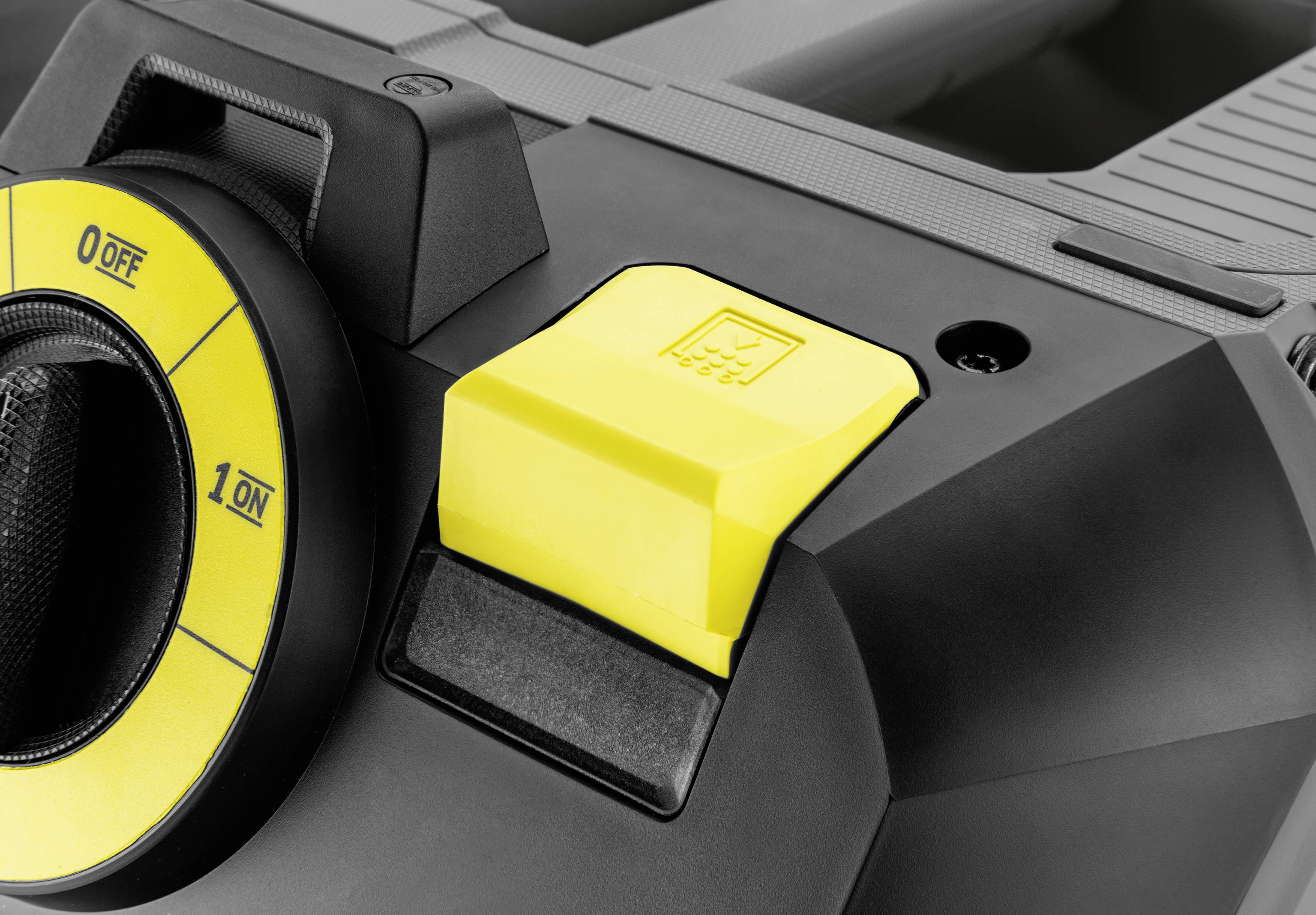 Close-up of a yellow rocker switch on a black household appliance, surrounded by a dial plate with the markings '0 Off' and '1 On'.