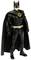A Batman action figure in a classic, black costume with cape and yellow belt stands upright.