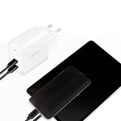 A smartphone and a tablet are being charged simultaneously via a white charger with two USB ports.