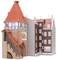 A model house with a red turret roof and half-timbering, adjoining a modern brick house.