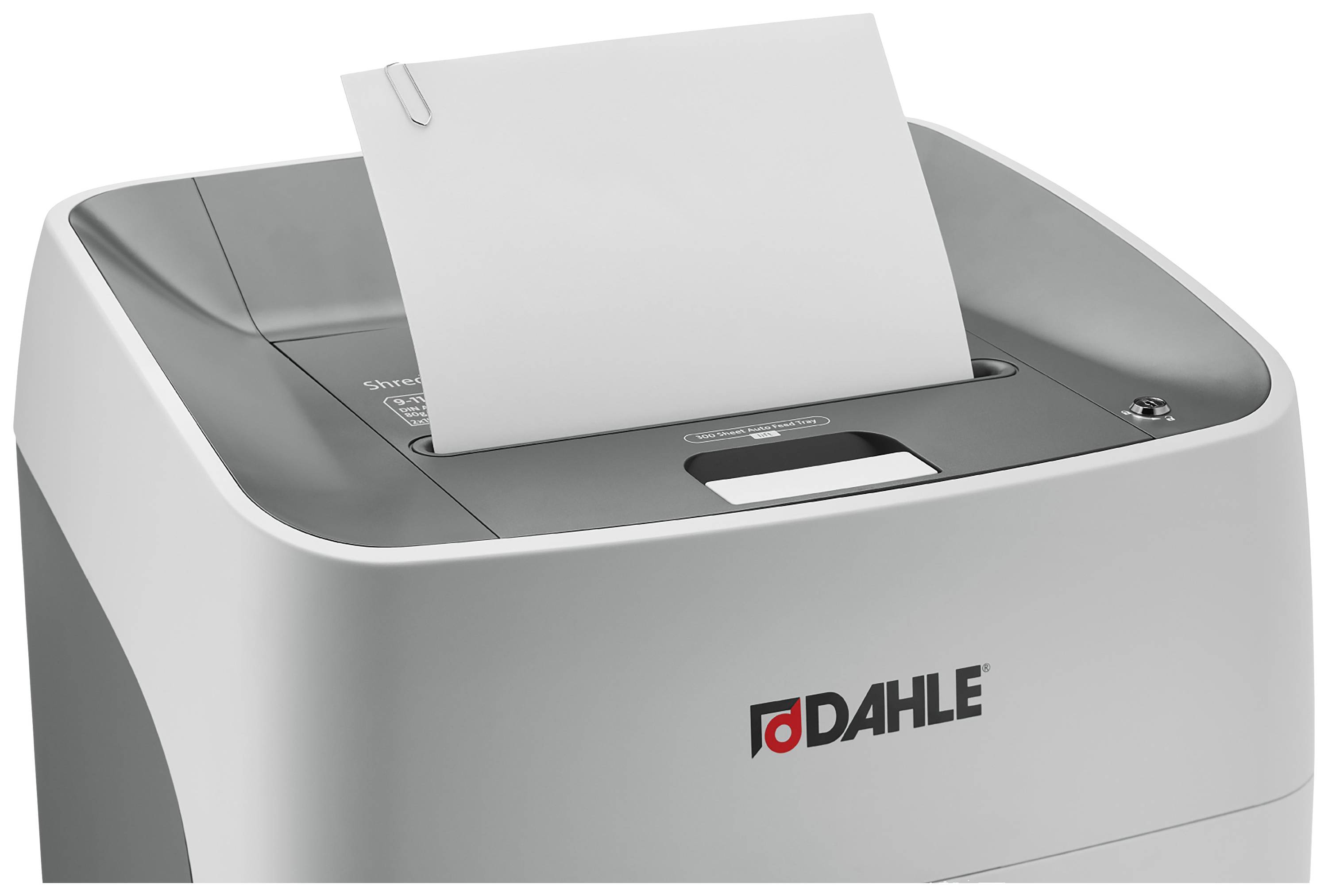 A paper shredder with a sheet of paper in the feed slot. The 'Dahle' brand is visible on the front.