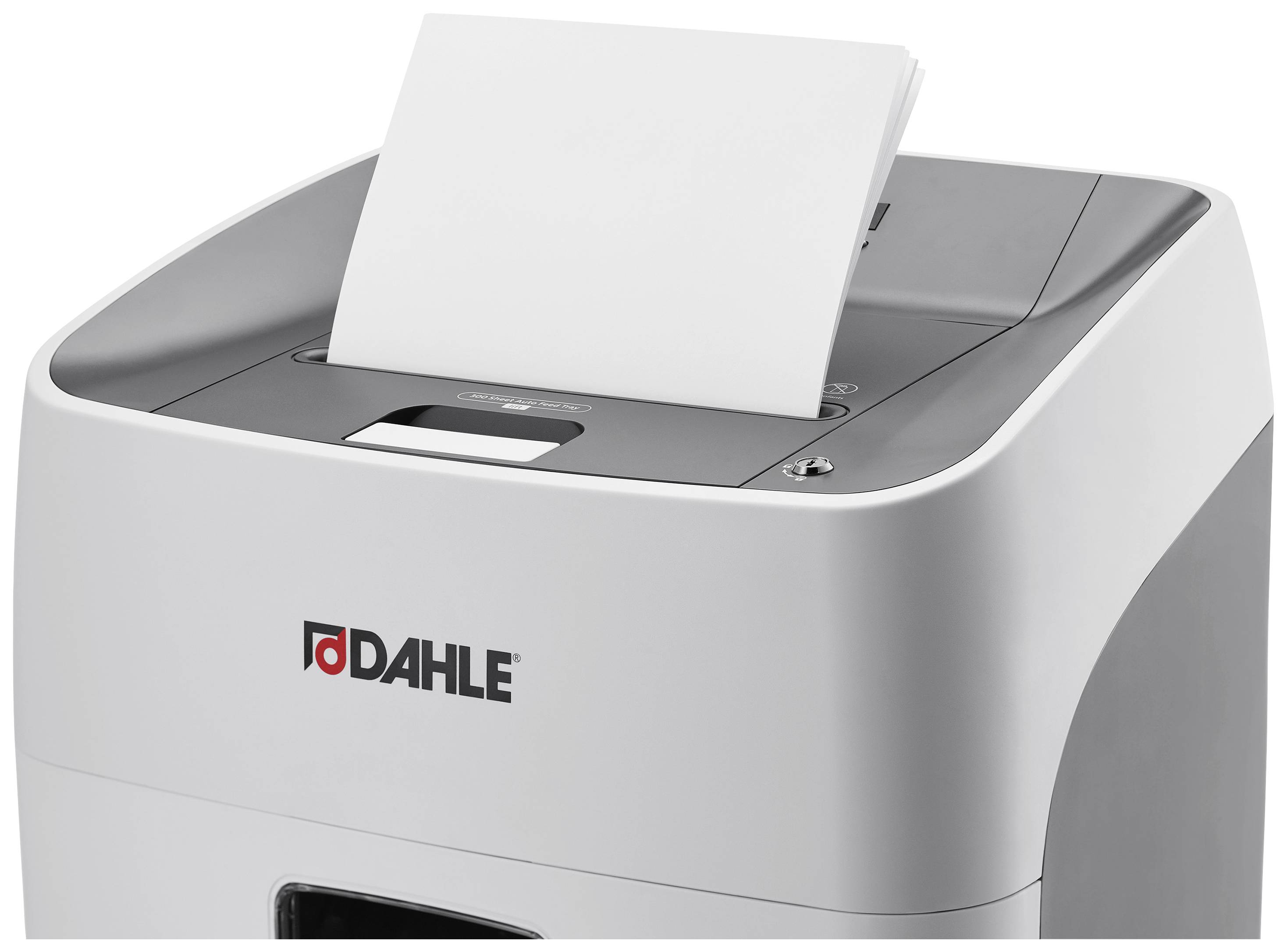 'A document is placed into a white Dahle paper shredder.'