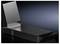 A black, rectangular metal channel with a vertical flap, set against a dark background.