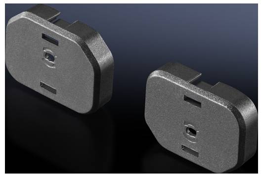 Two metallic adaptor plugs on a black background, each with cylindrical openings suitable for electrical connections.
