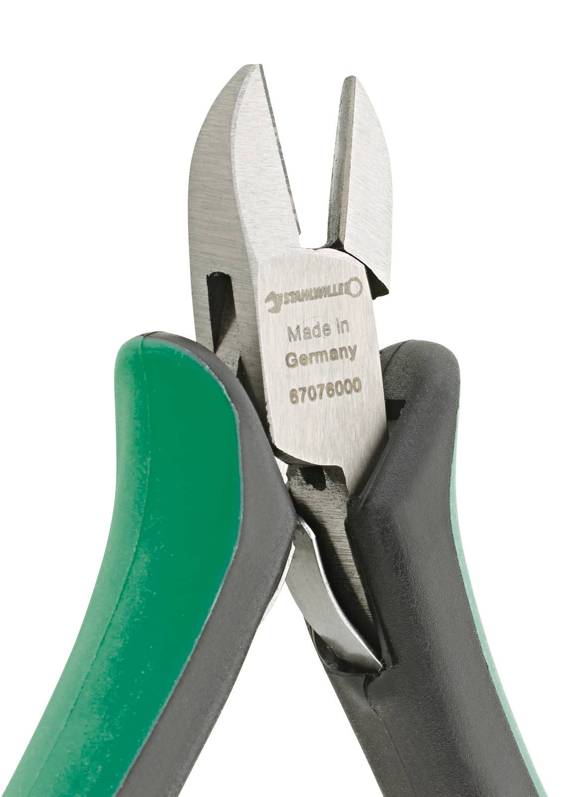 Side cutters with green and black handles, manufactured in Germany, brand marking visible.