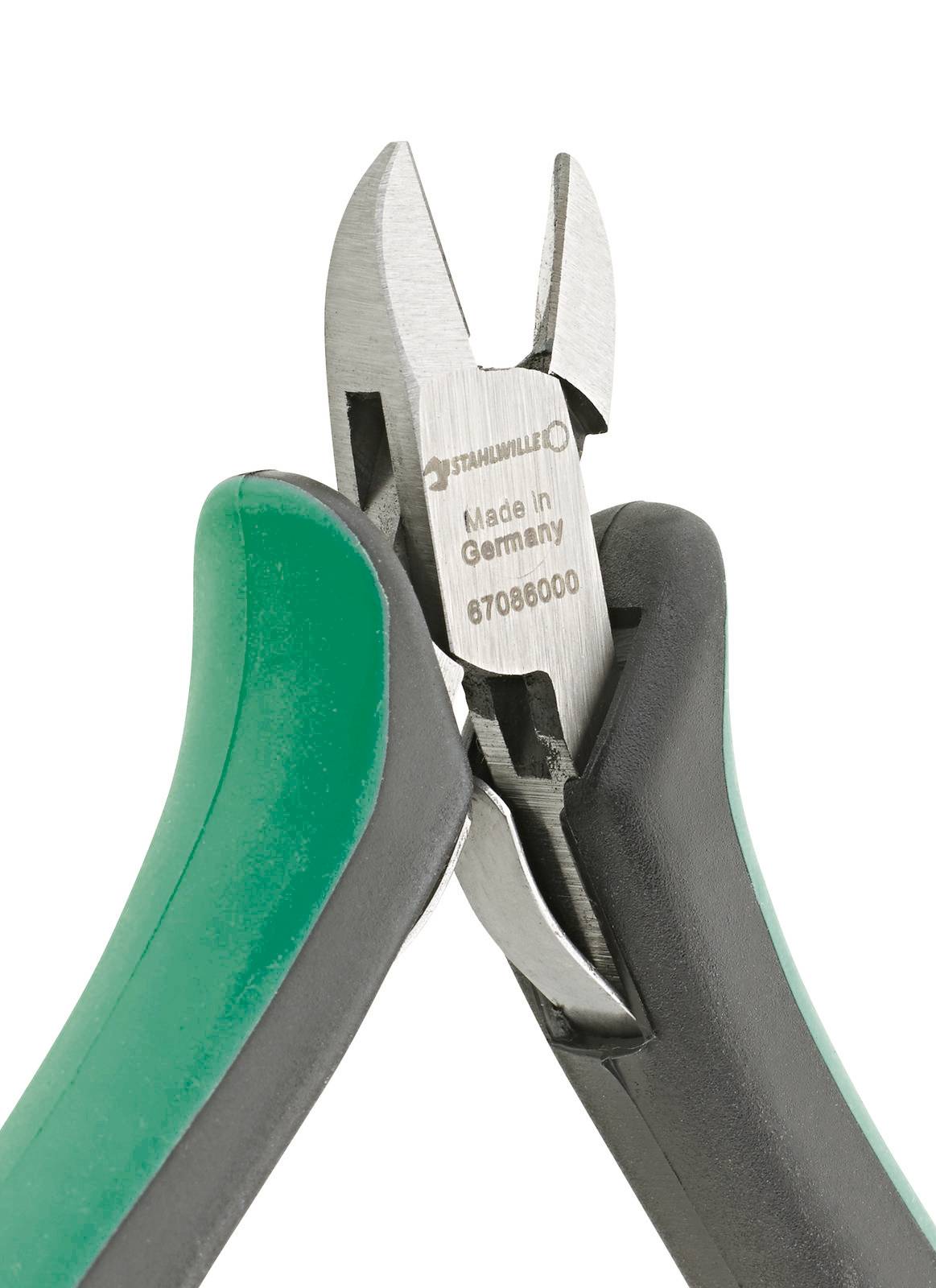 A green and black combination pliers with 'Made in Germany' printed on it, used for cutting wires.