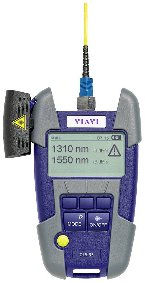 An optical power level measuring device with a digital display shows two wavelengths: 1310 nm and 1550 nm. Connected with a cable.