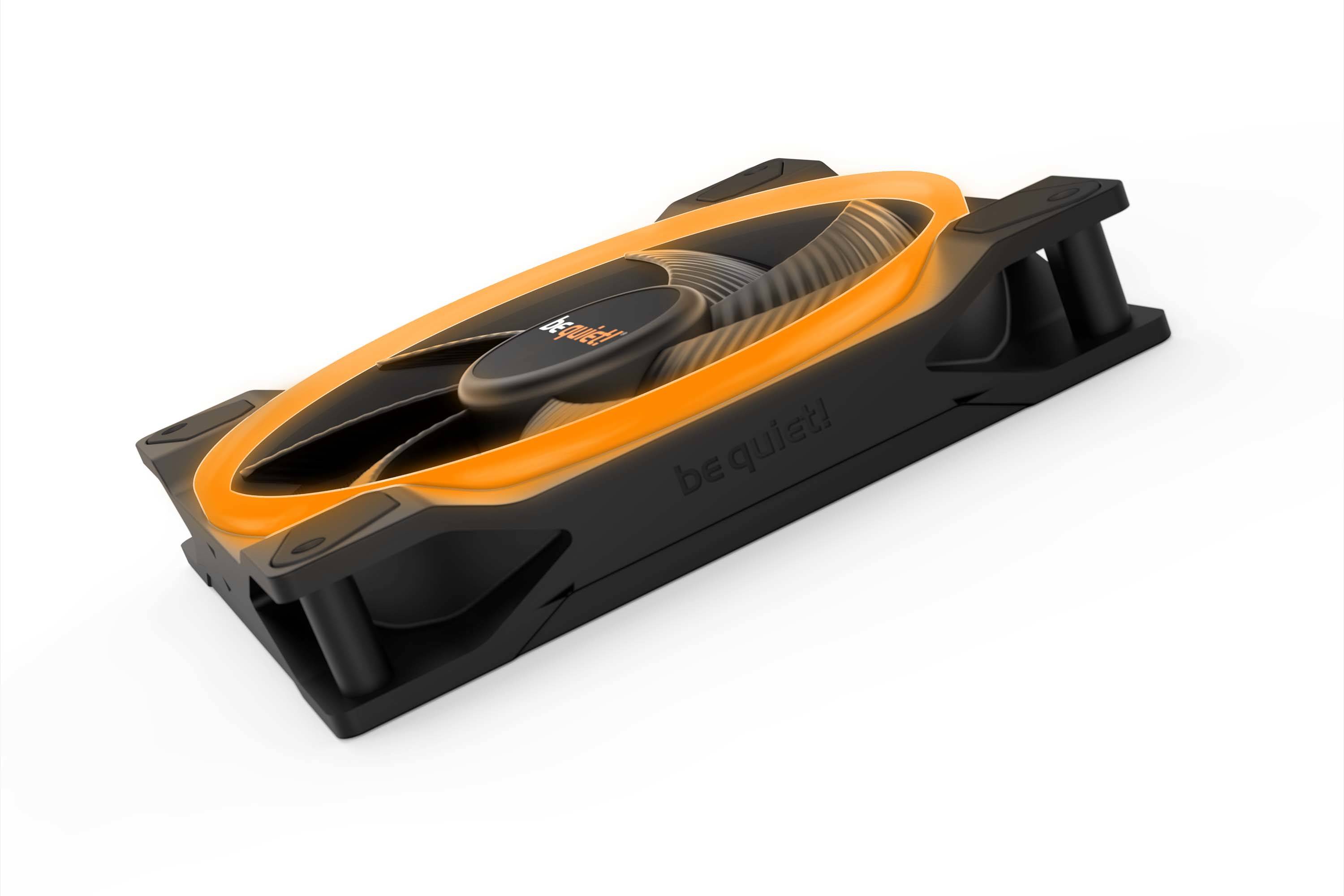 Black and orange PC fan by the brand 'be quiet!' in an angled view, lying flat, designed for quiet operation in computer cases.