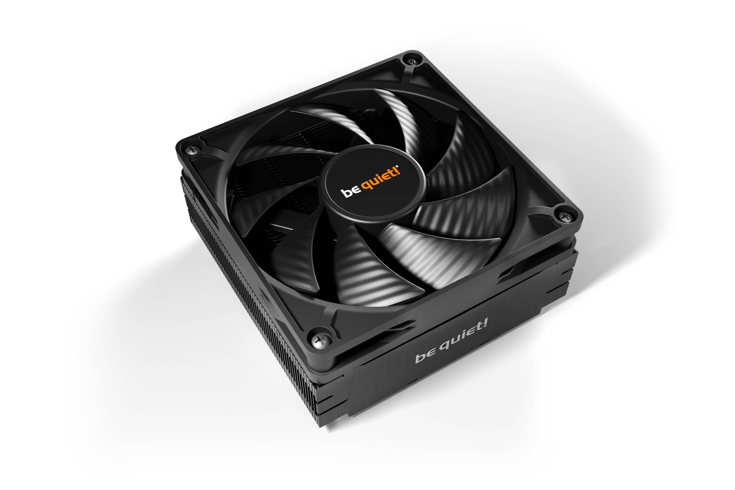 Black PC fan by the brand 'be quiet!' with four corner mountings, positioned above a heatsink.