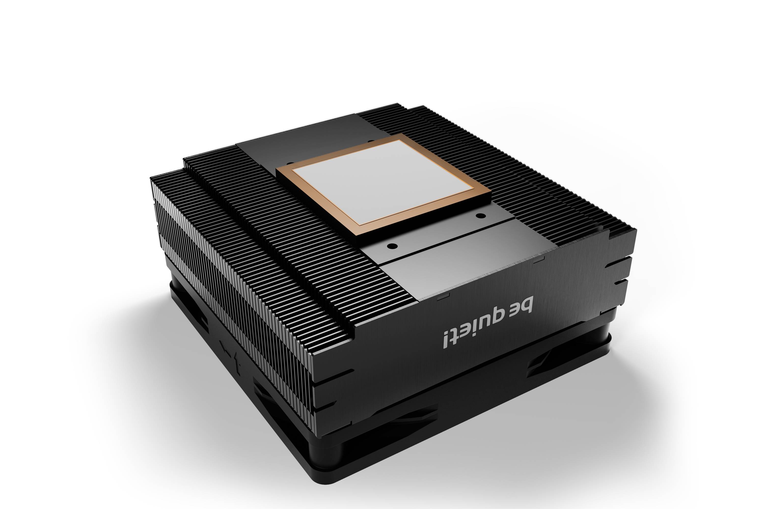 A black computer heatsink with a ribbed surface and a copper-coloured plate in the centre, on a light surface.