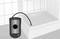 In the graphic, an inspection device with a camera probe is shown being used to examine the drainage system of a shower.