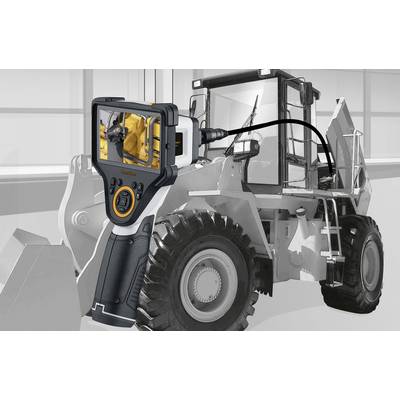 A handheld device with a display is used to inspect a large construction or industrial vehicle to examine its internal structures.