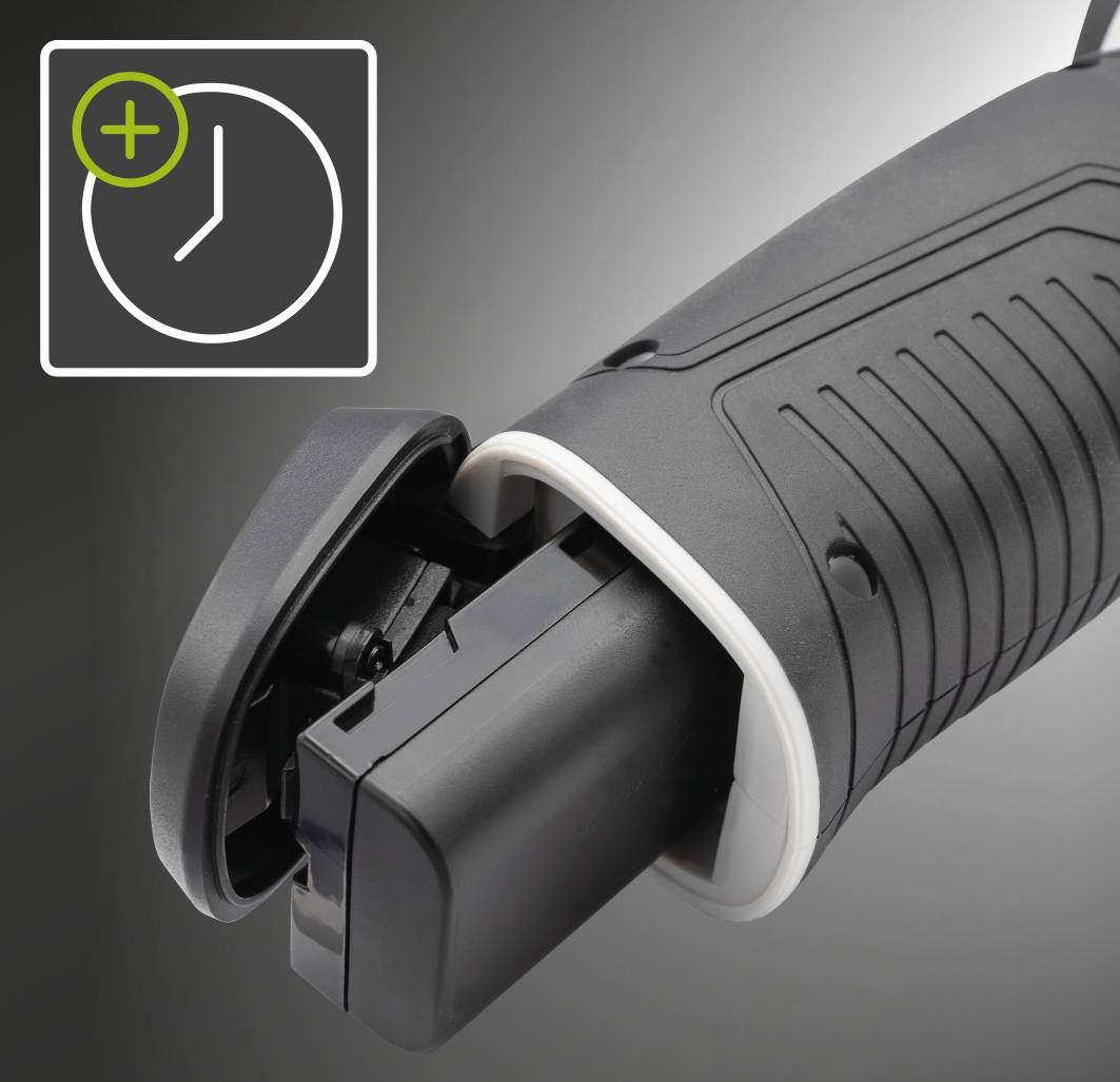 A battery pack is inserted into a housing, with a symbol for extended operating time in the upper corner.