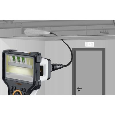 An inspection camera shows an image of three green switches in a ceiling cavity. The camera is connected to a cable.