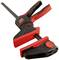 A red and black quick-release clamping system that securely fastens objects. Ideal for workshop tasks and DIY projects.
