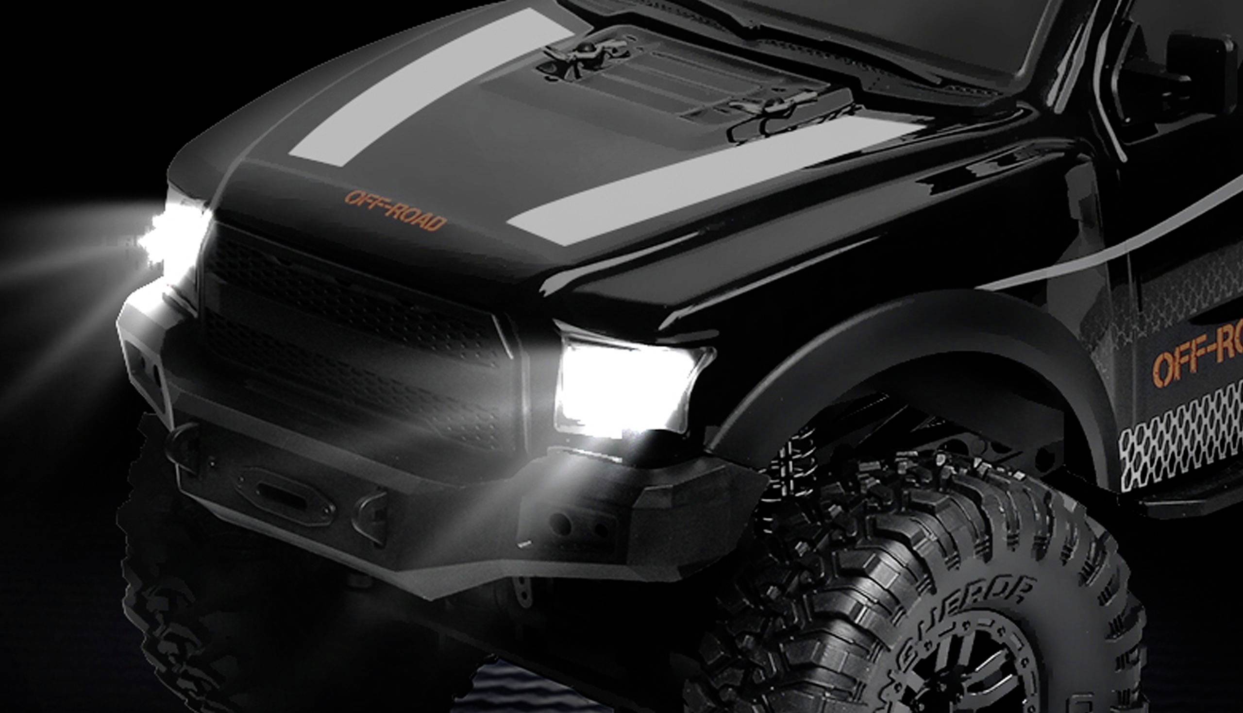 Black remote-controlled off-road car with illuminated headlamps against a dark background. Large tyres and 'OFF-ROAD' text visible.