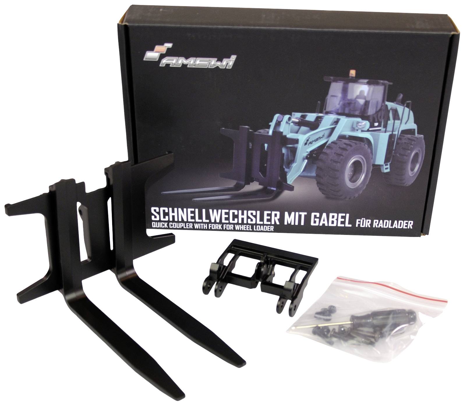 Box labelled 'Quick-change attachment with fork for wheel loader', showing an image of a wheel loader. Beside it are two forks and an adapter.