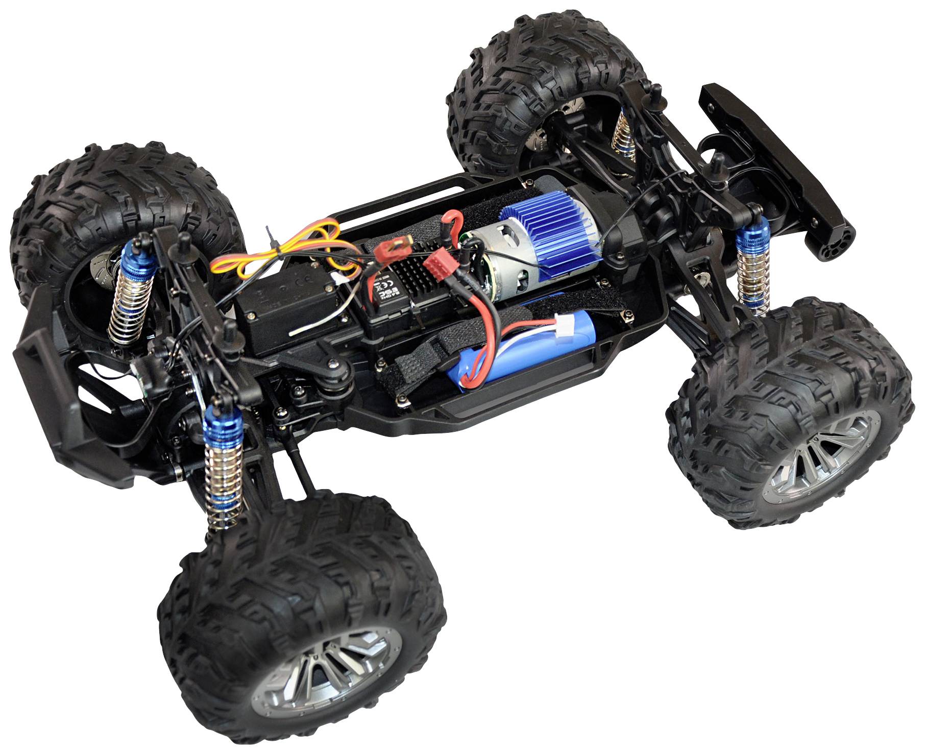 A remote-controlled car without bodywork, revealing its internal components such as the engine, battery, and suspension. Large, chunky tyres.