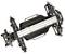 The image shows the chassis of a remote-controlled car, comprising a black frame, white struts, and suspension dampers.