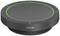 A round, black Jabra speaker with green LED lighting around the edge, suitable for meetings and conferences.