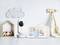 Baby monitor and camera showing sleeping babies. Camera set on white table with cloud and house decorations in the background.