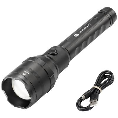 A black torch with a textured grip is lying next to a USB cable.