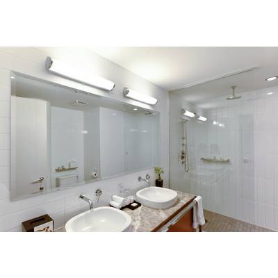 Modern bathroom with two washbasins on a marble vanity unit, large mirror, illuminated, with shower and white tiled walls.