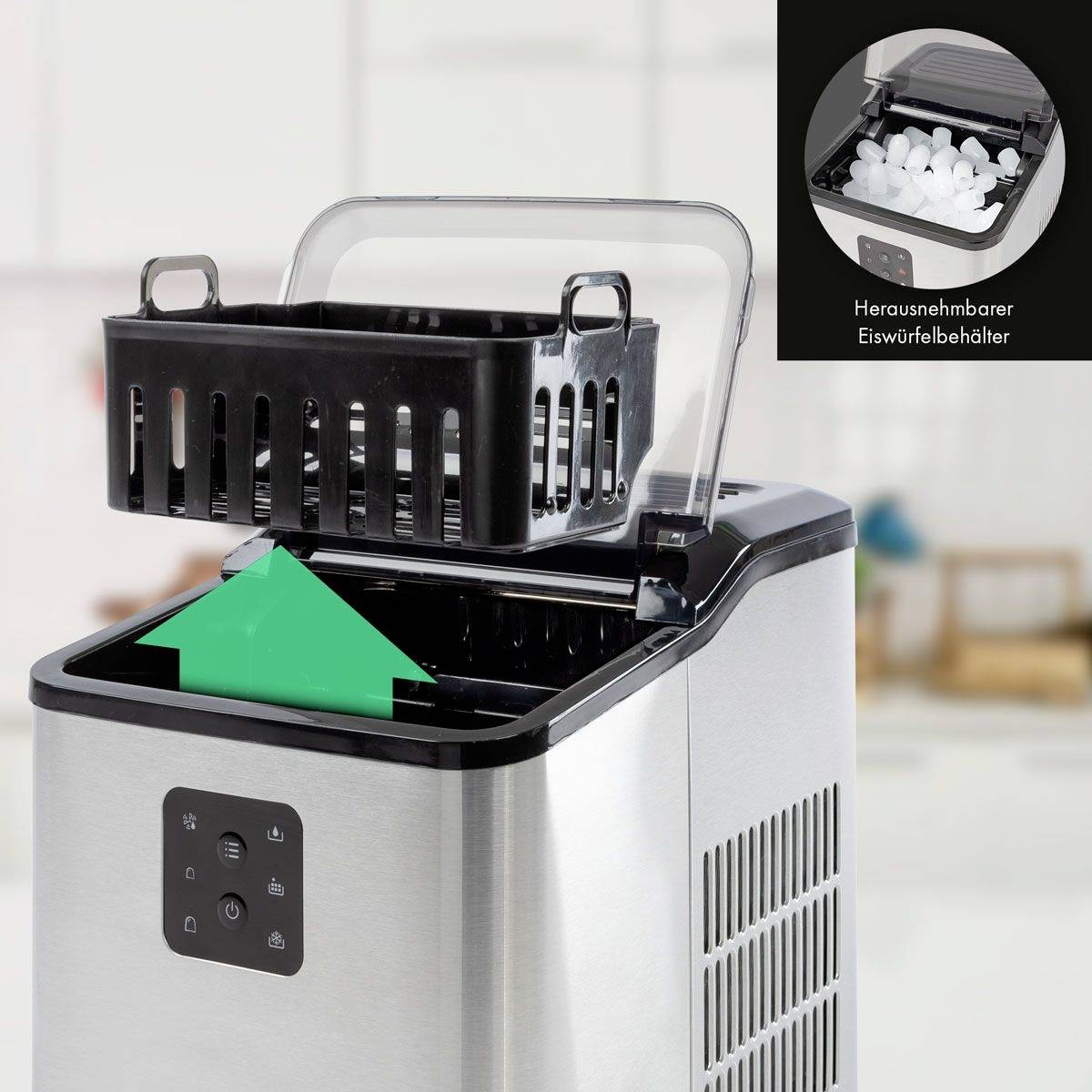 Stainless steel ice maker with a removable ice cube container. Blurred kitchen in the background.