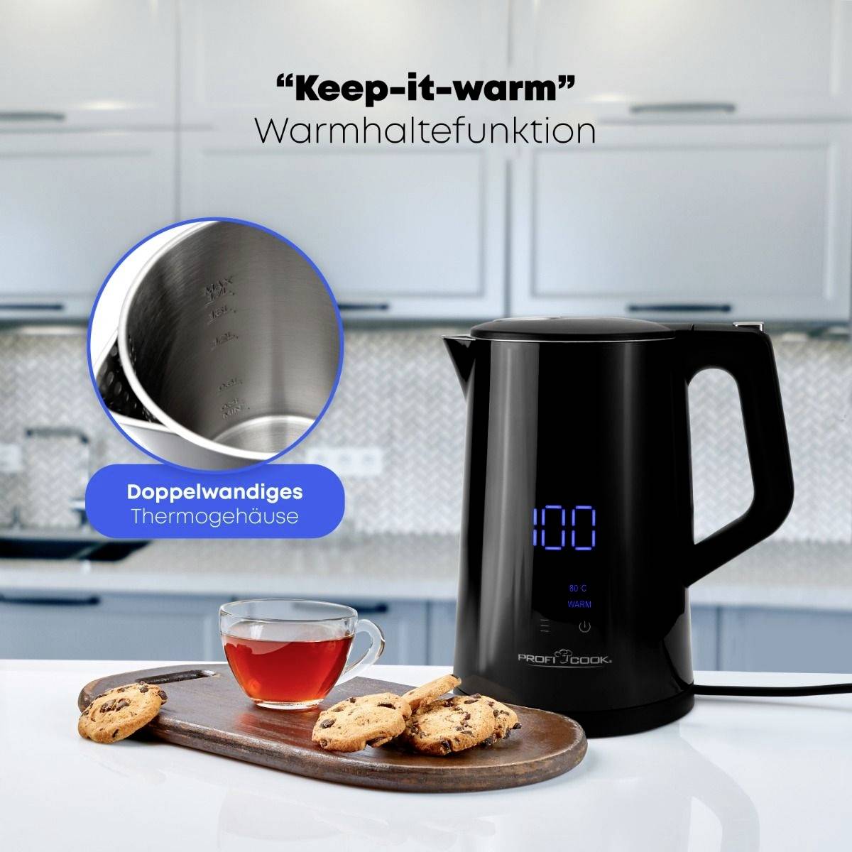 A kettle with a digital display sits on a kitchen worktop. Next to it, a cup of tea and some biscuits are placed on a wooden board.