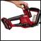 Battery-powered Einhell hedge trimmer, red and black, with ergonomic handle; hand inserting battery into the device.