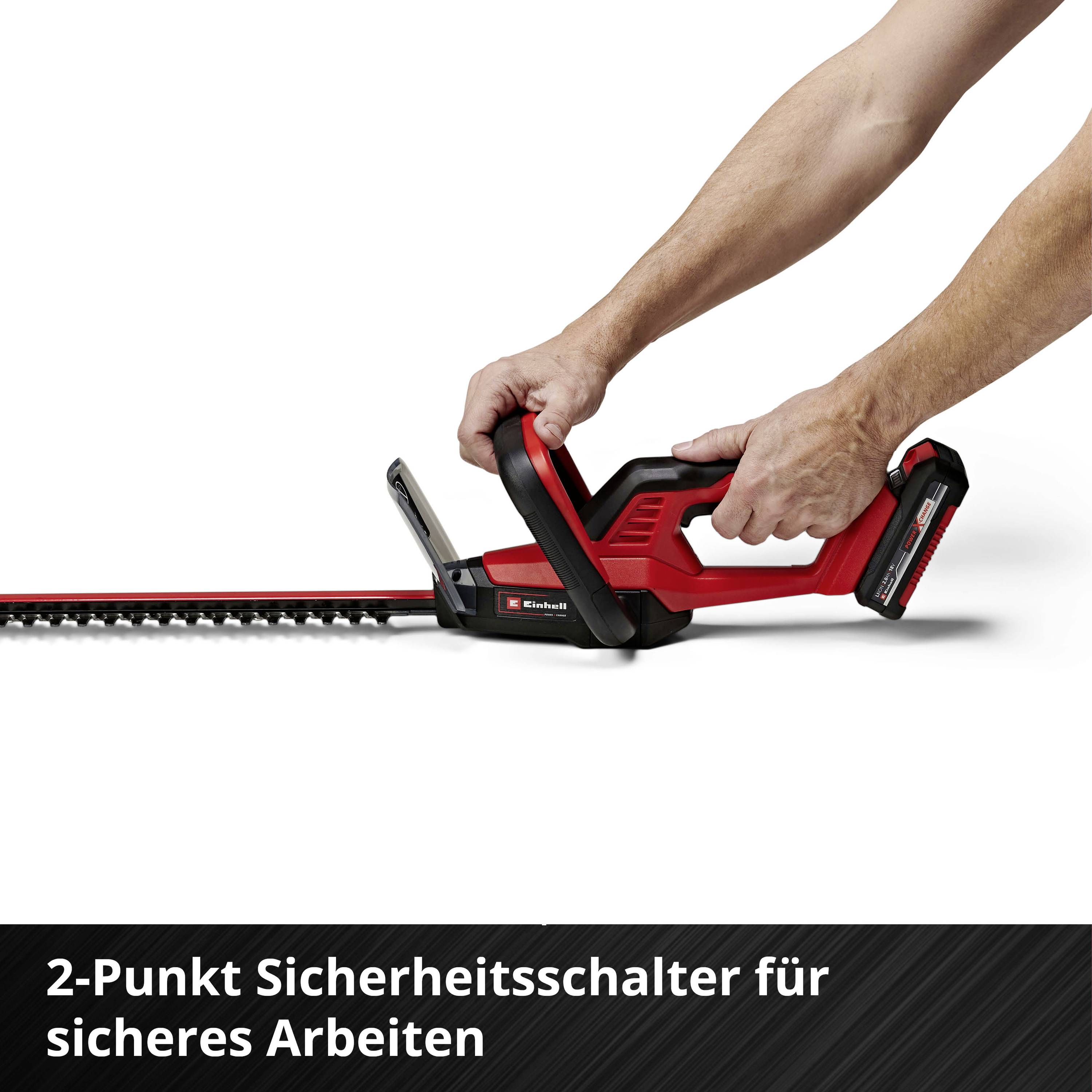 Hedge trimmer with two handles and two-tone design. Text: 'Two-point safety switch for safe working'.