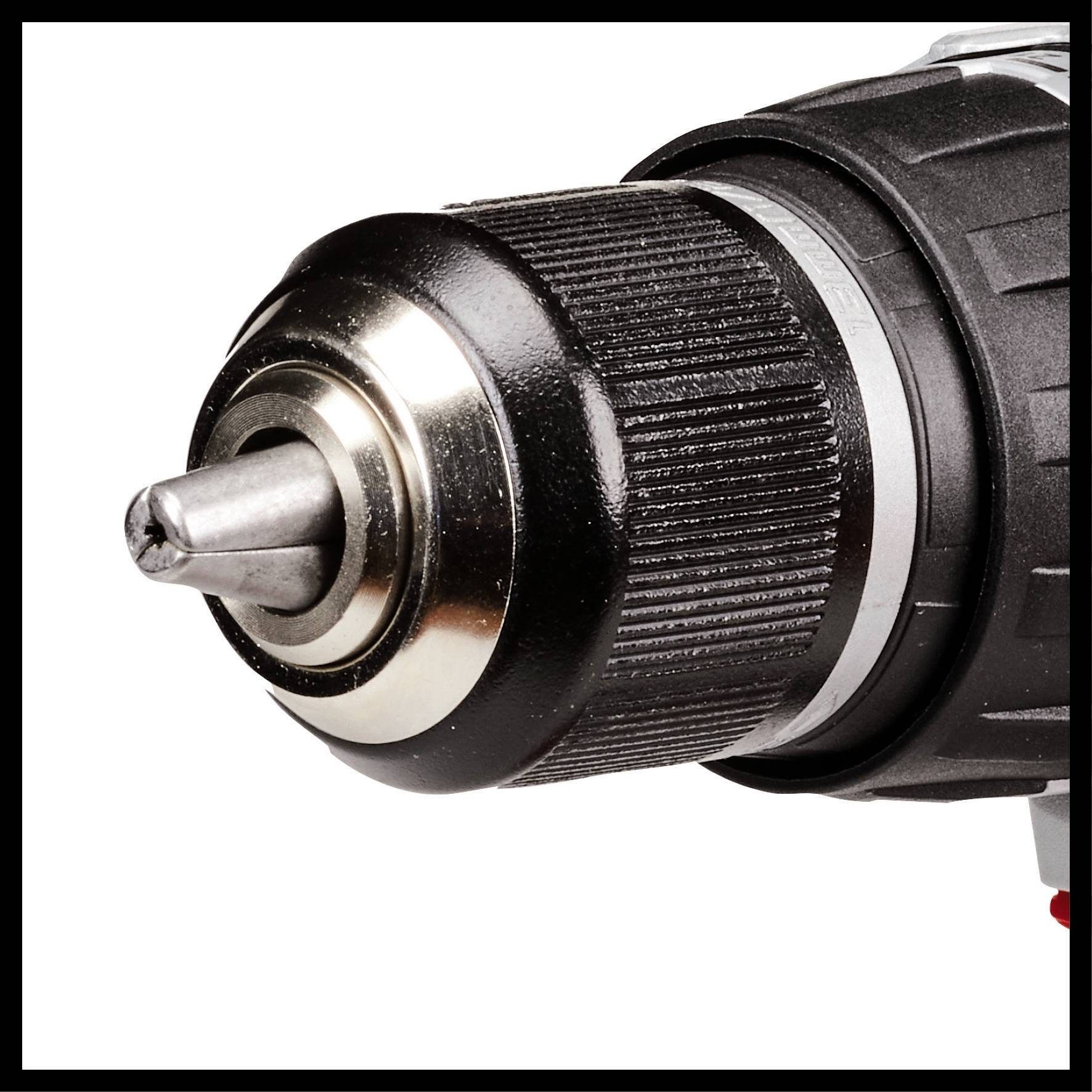 Close-up of a black and silver drill head with a drill bit ready for use.