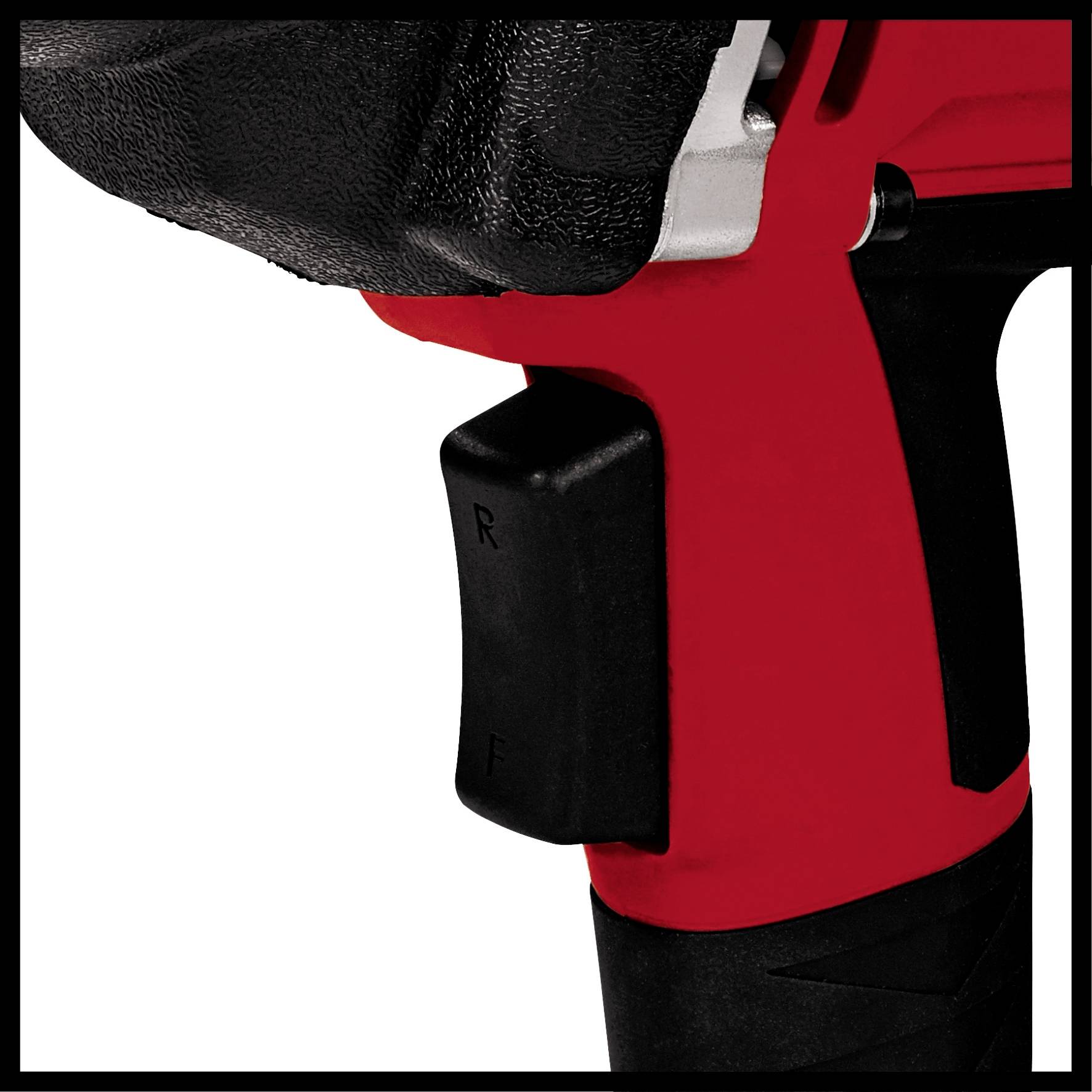 Close-up of a red electric power tool with a black rubber grip and a switch marked 'R' and 'F' for direction control.