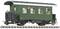 Green model railway passenger carriage with a curved roof and four windows, placed on rails.