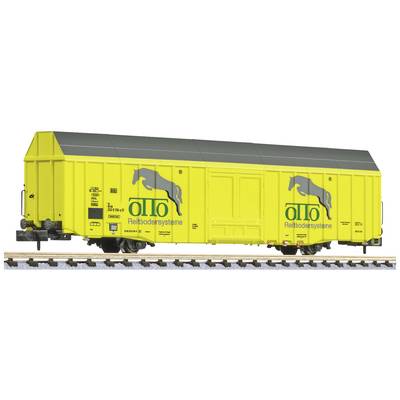 Yellow railway goods wagon with a black roof and inscription 'otto Reitsbodensysteme', side view on railway tracks.