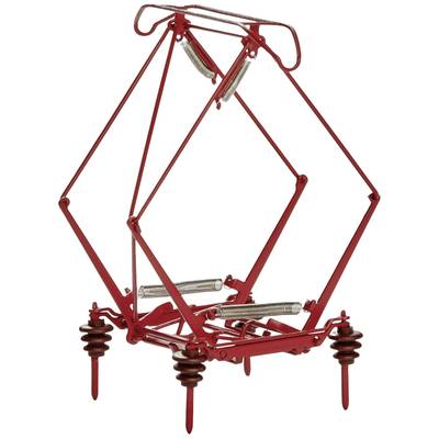 A red, intricately crafted device with feathers and metal components, reminiscent of a trap, standing on four insulating feet.