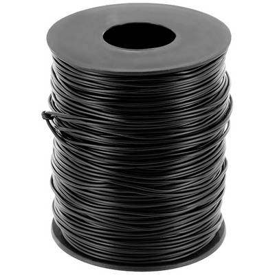 A large, black cable reel stands upright.