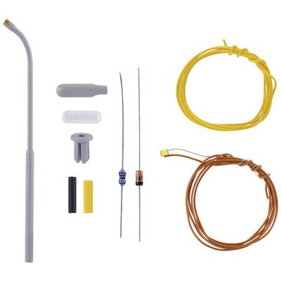 Several electronic components, including wires, a grey curved plastic tube, resistors, and plastic caps, on a white background.