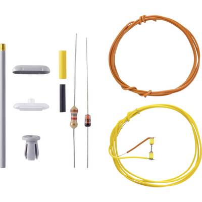 A kit with various electronic components: resistors, wires in orange and yellow, along with plastic sleeves and metal pins.